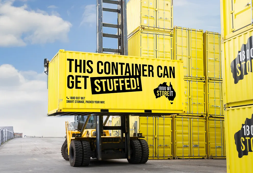 1800 We Store It livery: a yellow storage container lifted by a forklift, “This container can get stuffed!”