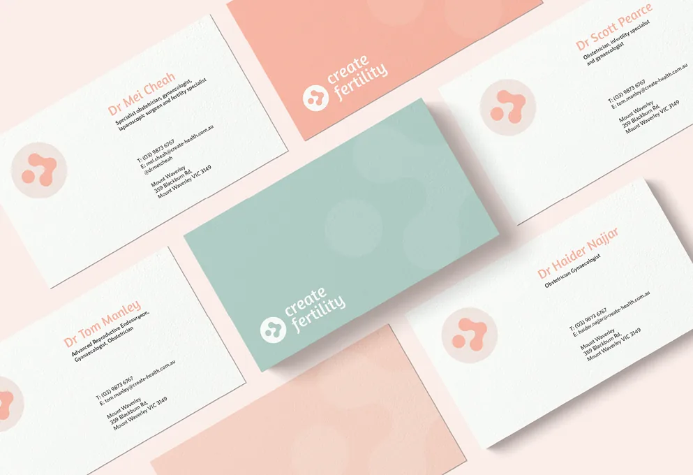 Create Fertility business cards in coral, mint and white