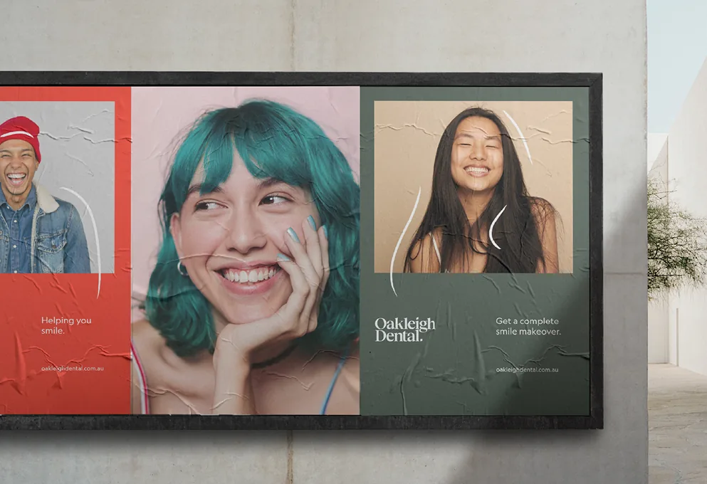 Oakleigh Dental billboard: three smiling portraits beside the Oakleigh Dental wordmark
