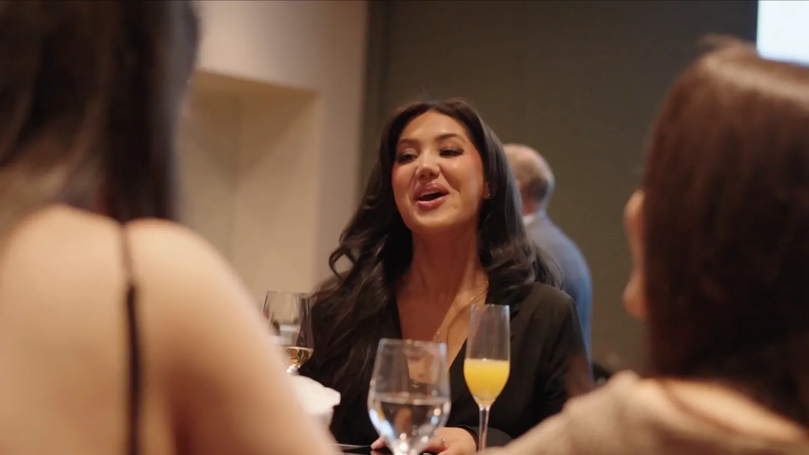 Guests talking over drinks at a First Class Legal dinner event